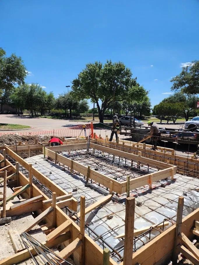 Crew setting foundation formwork and rebar in DFW