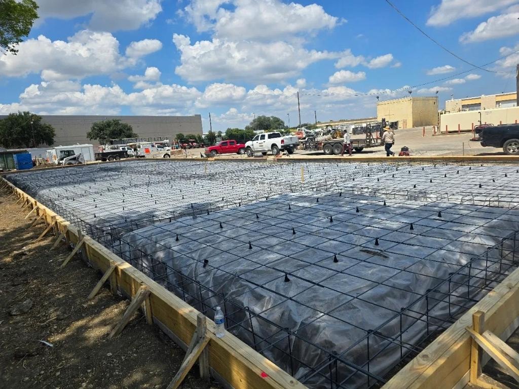 Large commercial slab with rebar grid and vapor barrier