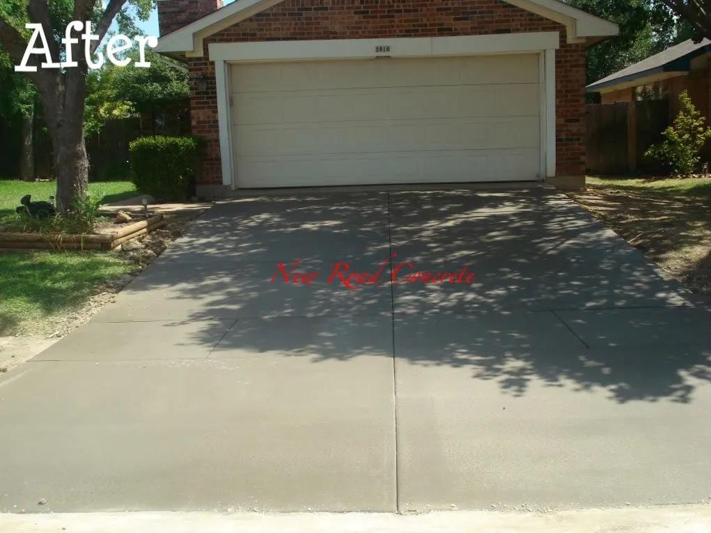 After: finished concrete driveway at brick home in DFW
