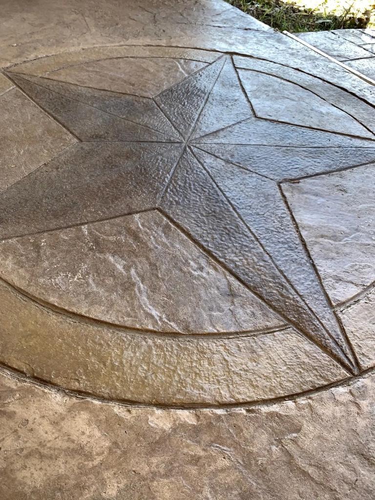 Decorative stamped concrete with Texas star medallion detail